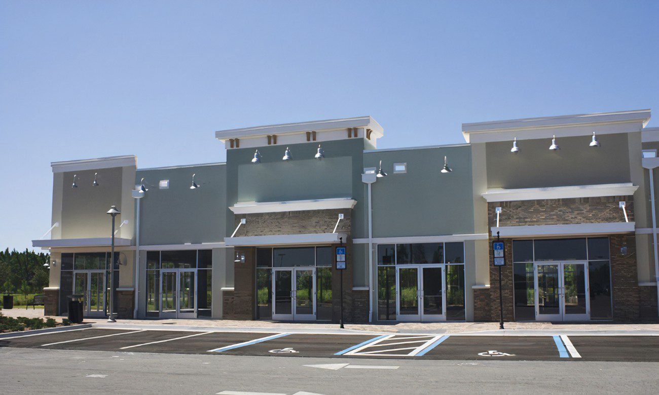 A large commercial building with many windows and doors.